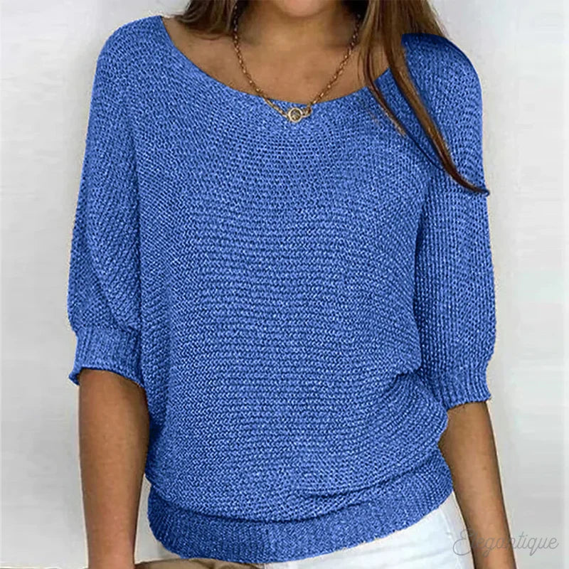 Woman in a blue textured knit sweater