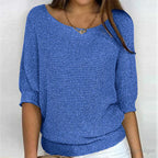 Woman in a blue textured knit sweater
