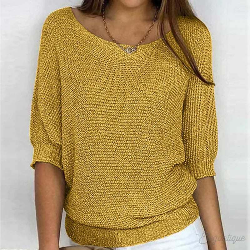 Woman wearing a yellow textured knit sweater