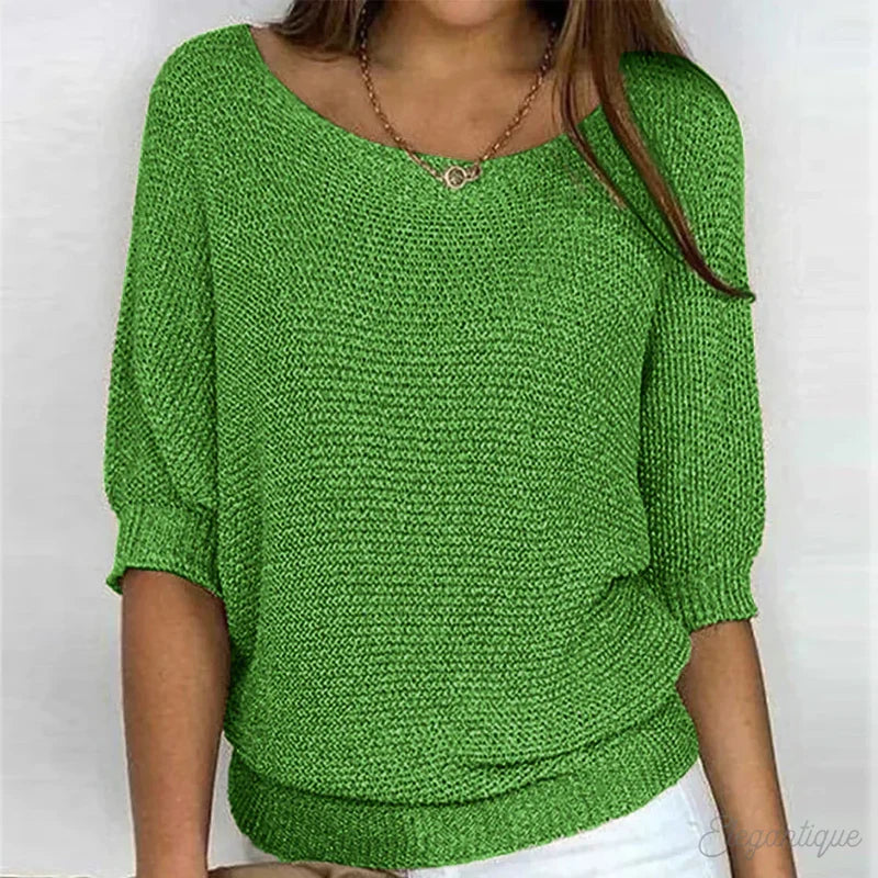 Woman in a green textured knit sweater