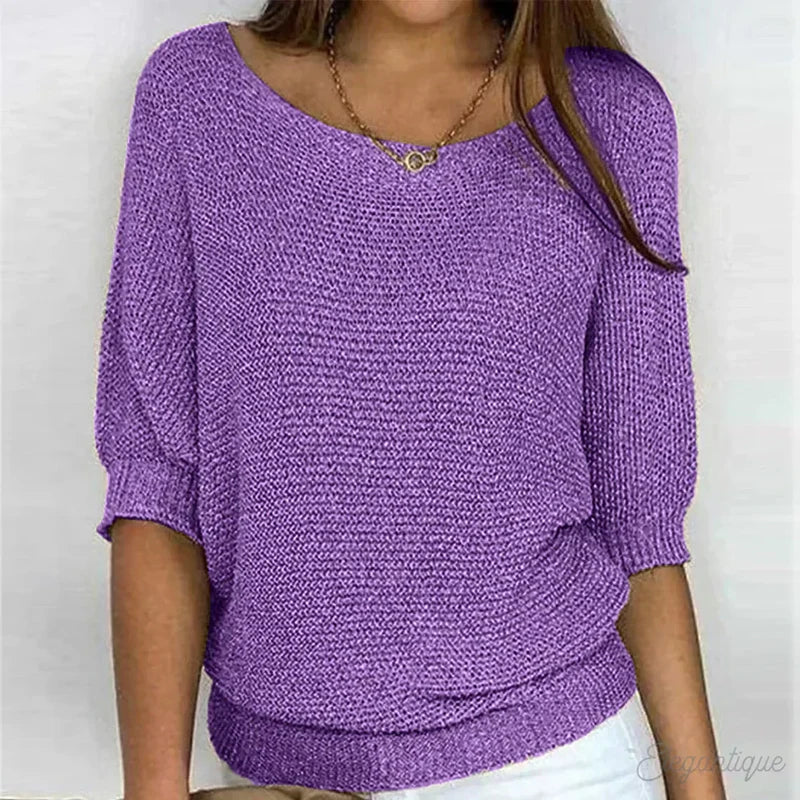 Woman in a purple textured knit sweater