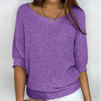 Woman in a purple textured knit sweater