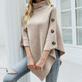 Women's turtleneck knit poncho with buttons in beige – front view