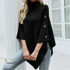 Women's turtleneck knit poncho with buttons in black – front view